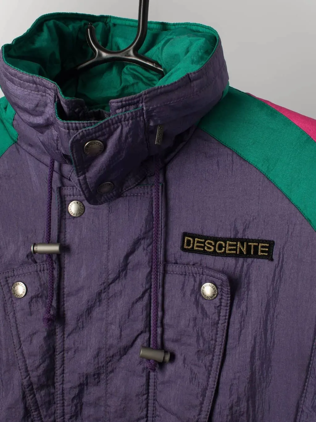 Vintage 80s padded ski jacket in purple & pink by Descente Suisse ski team. Made in Japan – Small / Medium