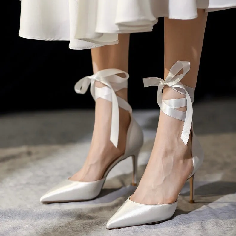 White high-heeled pumps.