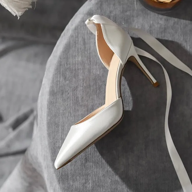 White high-heeled pumps.