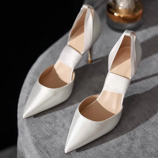 White high-heeled pumps.